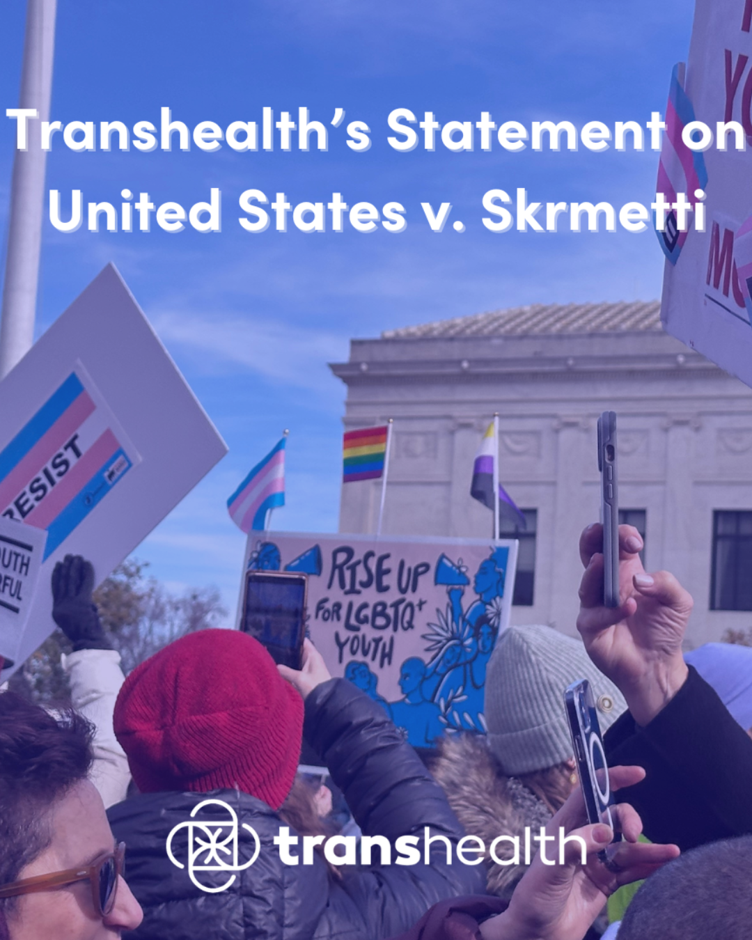 People holding trans rights signs and flags in front of the US. Supreme Court